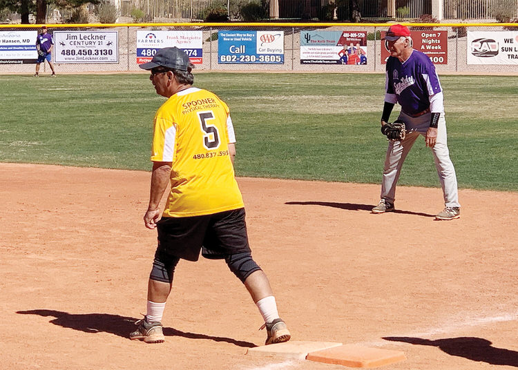 A photo from the Sun Division championship game: Dave Martin is on base as first basemen. Dave Waibel awaits the next pitch. (Photo courtesy of Captured Moments Pictures)