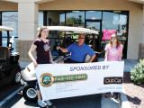 George was awarded his prize by Jennifer (left) and Amanda (right) from Par-Tee Time Golf Carts of Sun Lakes who provided the cart for this year’s raffle.