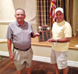 CMGA President, Rick Nelson, left, passes Home and Home trophy to Howard Weiss, MOGA President.