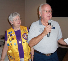 Sun Lakes Lions Club President Ruth Palmer looks on as Dave Mattson, representing the Sun Lakes Fire Department’s Community Assistance Program, accepts a $200 donation for the CAP organization. Mattson thanked the Lions and highlighted how CAP works with the Fire Department to assist the residents of Sun Lakes in their time of need.