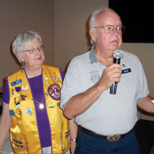 Sun Lakes Lions Club President Ruth Palmer looks on as Dave Mattson, representing the Sun Lakes Fire Department’s Community Assistance Program, accepts a $200 donation for the CAP organization. Mattson thanked the Lions and highlighted how CAP works with the Fire Department to assist the residents of Sun Lakes in their time of need.