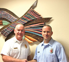 Sun Lakes Fire Department Chief Paul Wilson congratulates Capt. Craig Dimerling on his 15th anniversary with the SLFD.