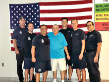 Surrounding Mr. Marr in the blue shirt is the lifesaving crew (left to right) firefighter Tom Geffert, firefighter Ricky Quinn, paramedic Les Legarreta, firefighter Brent Kohl, engineer David DeGraaf and Captain Robert Olmstead. Mr. Marr said, “These men are my heroes.”