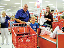 Don Prestin and child and volunteer, Mrs. Hal Wochholz.