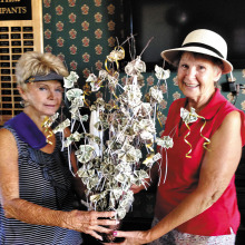 Barbara DeNapoli presenting El Hinerichsen a money tree in celebration of her August wedding.