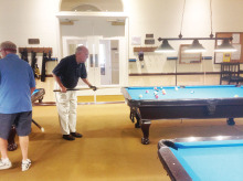 IronOaks Breakers Pool League member Bill O’Donnell preparing for his next shot. Photo taken by Willie Foster.