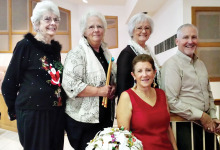 Pictured left to right are Ticket Chairperson Gerry Lecky, Percussionist B. J. Van Noy, Choral Director Cris Evans, Performance Coordinator Bart Evans, and (in front row) Graphics Designer MJ Clement