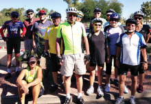 Riders gather at the flagpole in Cottonwood before a Monday ride.