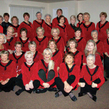 The Chordaires Show Chorus decked out for Christmas; new Director Adam Thome is standing second from the left in the back row. Come to a free performance!