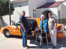 Stephen Minister Coordinator Ramona Ehrmantraut, center, with Acme Cab Co. president Ron Mills and Associate Pastor Tracy Perry in front of the Sun Lakes UMC Sanctuary.