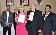 Sun Lakes residents Rose and Dennis Pachura (center) receive an award for their continued support and services to the Pulaski Club.