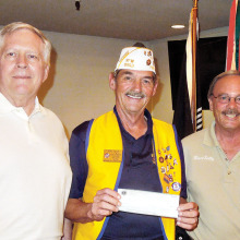 Lions Club members Gander and Sully with Commander Peer