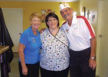 Betty Peer, VFW Auxiliary Post 8053, Amy Karpovich and Neal Peer, Commander VFW Post 8053 accept $910 check for veterans.