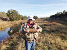 Frank Mills holding one of the 20 trout caught by members of the Sun Lakes Fly Fishing Club on a recent 3-day trip.