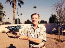 Pearl Harbor survivor Jack Holder displays a model of the PB-Y Catalina patrol aircraft he flew in as flight engineer during World War II. He has written a book about his experiences during the war.