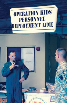 General Scott L. Pleus, Commander, Luke Air Force Base, addresses approximately 200 “troops”, ages 5-14, prior to their “overseas deployment” during the kickoff of Operation Kids last month.