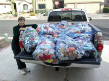 Johnnie Schofield standing next to her truck filled with 2,400 Beanie Babies which an anonymous person gave to us.