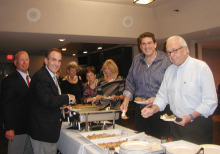 Members of the Italian American Club prepare to enjoy hearty appetizers