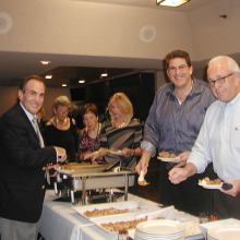 Members of the Italian American Club prepare to enjoy hearty appetizers