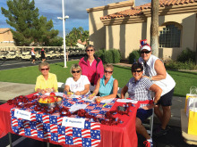 Pictured left to right are Louise Burke, Sheila Junkermeier, Betty Schechter (standing in pink), Nan Atkison and Diane Ehrhardt and Marla Calley at the registration table.