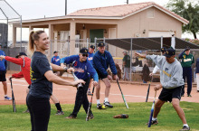 No, that’s not a ballet class. It’s Jessica Sorensen of Spooner Physical Therapy conducting dynamic stretching warm-up exercises!