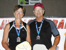 Atop the podium are gold medal winners Jeannine and Kelly McKinna