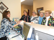 Pictured (left to right) Vincenza Heisler reviews New Adventures in Learning’s class registration procedures with Sue Schwartz, Debbie Oliver, Marge Troche and Nadine Cords.