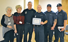 Co-leaders of the HLAOA group Regina Milgroom (left) and Liz Booth present SLFD members firefighter Roggeman, Captain Dimerling and firefighters Moreni and Johnson with a certificate thanking them for their presentation. (Photos and caption by Brian Curry).