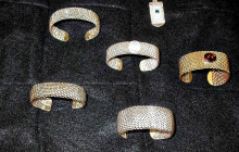 A few of the jewelry pieces long time member Tom Hall has made; he has also made woven sterling jump-ring bracelets.