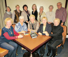 Cheers Singles Club meets the first Tuesday of the month for book club; 12 members are pictured.