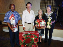 Winners of our door prizes at the December dance from left to right are Ralph Richardson, Ross Dupuis, Geri Trezona and Lee Evans