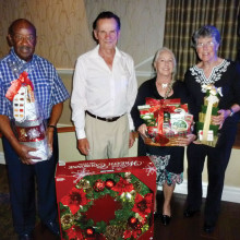 Winners of our door prizes at the December dance from left to right are Ralph Richardson, Ross Dupuis, Geri Trezona and Lee Evans
