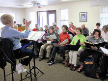 Interdenominational choir from the Sun Lakes Chapel rehearsing with director Lana Oyer of the Sun Lakes Jewish Congregation in preparation for Rockin’ Our Souls concert.