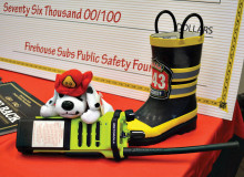 One of the three dual band emergency radios purchased by the Sun Lakes Fire Department with the Firehouse Sub foundation grant is posed at the Phoenix press conference.