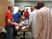 Lew Bradley, Dave Lott, Christine Rice and Bill McCaffrey assemble root beer floats for veterans.