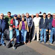 Sun Lakes Aero Club members and guests making the trip to Marana are pictured in front of Bill Brown’s Cessna 182: Standing (l-r) Earl Cuyler, Hank Bielema, Gary Vacin, Gene Evans, Jessica Cox, Dick Simmons, Roger Bartels, Bob DeLong, Bill Brown, Steve Perkins, Gary West and J.R. Schiedereiter; kneeling Louis Cuyler