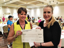 Vice President Anne Annis presents check for $2,655 to Jaxston “Jax” Kyle of St. Mary’s Food Bank Alliance on January 20, 2015.