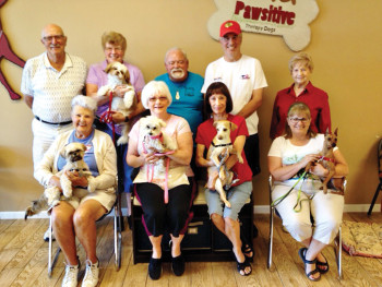 Pictured - row one are Bonnie Forbes with Tulley, Phyllis Johnson with Zoe, Mary Smitham with Rudy and Cindi Decker with Jimmy; row two are Tony Forbes, Paula Ferguson with Chloe, Charles Johnson, Steve Smitham and Pat Harpster; not pictured is Dale Harpster with Siri