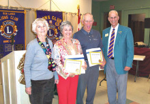 Pictured left to right are Lion Elaine Hair, sponsor of Linda Reecer and John Seigla