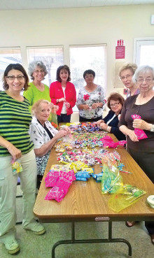 Members filling candy bags to be used for the Easters bags.