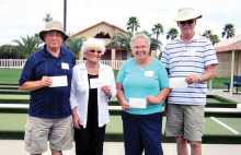 The first place winners of the second annual Sisk Park Bocce Club Tournament proudly hold their winnings: Tony Racano, Le Knecht, Nancy Vanderslice and Doc Heckler.