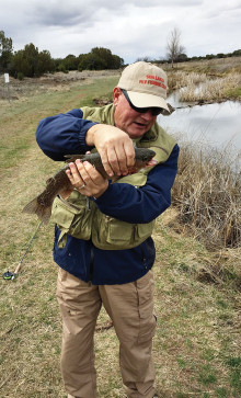 Ernie Papacek holding a nice rainbow trout that he landed at Silver Creek in March on one of our overnight trips.