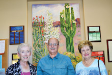Susan Meer (left) and Barbara Stewart (right) present a check to Eric Ehst, Executive Director of Neighbors Who Care