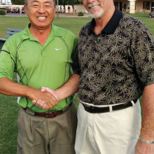 MOGA President TJ Jones (right) congratulating Peter Yoon on winning the MOGA Club Championship