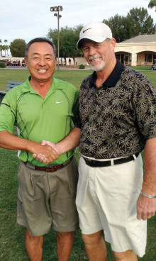 MOGA President TJ Jones (right) congratulating Peter Yoon on winning the MOGA Club Championship