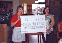 Betty Dupuis presents our contribution to The University of Arizona Foundation representative Sarah Gonzales
