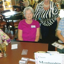 Patricia Ray (seated in the center) will greet you at the Cheers membership table on Thursdays!
