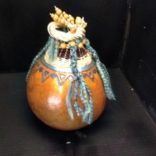 This gourd was created by Patti Langton combining weaving techniques, yarns and organic embellishments. Great job, Patti!