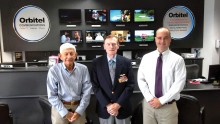 Pictured left to right are Paul Zimmerman from San Tan Rotary, WWII veteran Jack Holder and Orbitel Communications president John Schurz.