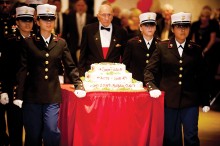 “Oldest Marine” Mike Harper, a Sun Lakes resident and WWII veteran, is escorted to the cake cutting ceremony.